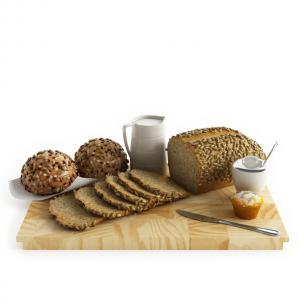 装饰瓜子仁的粗麦面包、牛奶食物食品