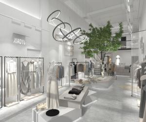 种植植物的浅灰色调女装服装店