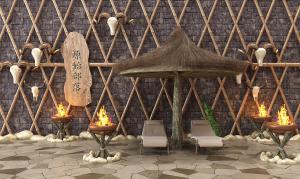 茅草棚、休闲椅和篝火民族庭院景观