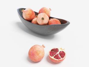 放在水果篮里的石榴、切开的石榴水果食物