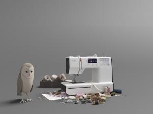 现代白色电动缝纫机、线团