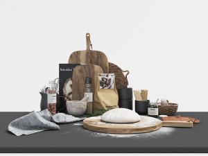 摆放在操作台上的砧板面团、收纳篮厨具用品