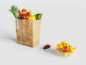 纸袋和玻璃碗里的蔬菜水果