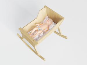 躺卧在实木摇床里的婴儿